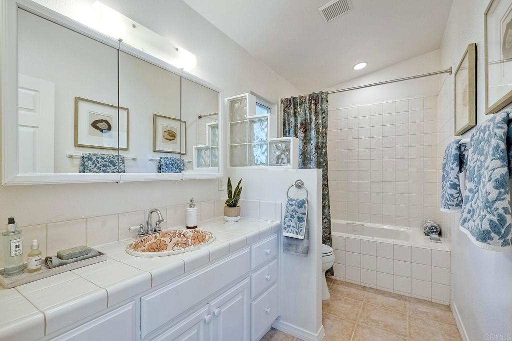 3897 Park Drive Carlsbad, CA 92008 - Photo 24 of 39 a bathroom with a sink and a bathtub