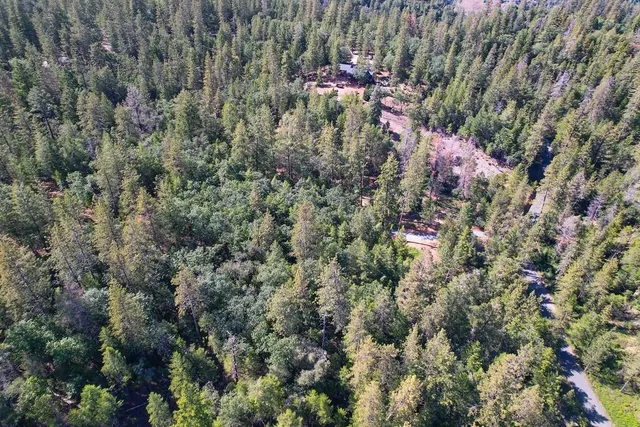 a view of a house with a flower garden