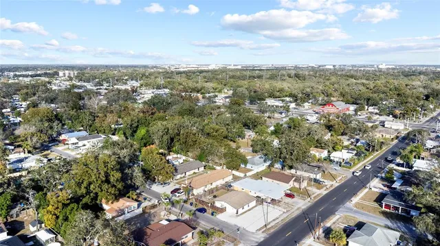 an aerial view of city and lake