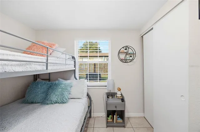 a bedroom with a bed and a table in it