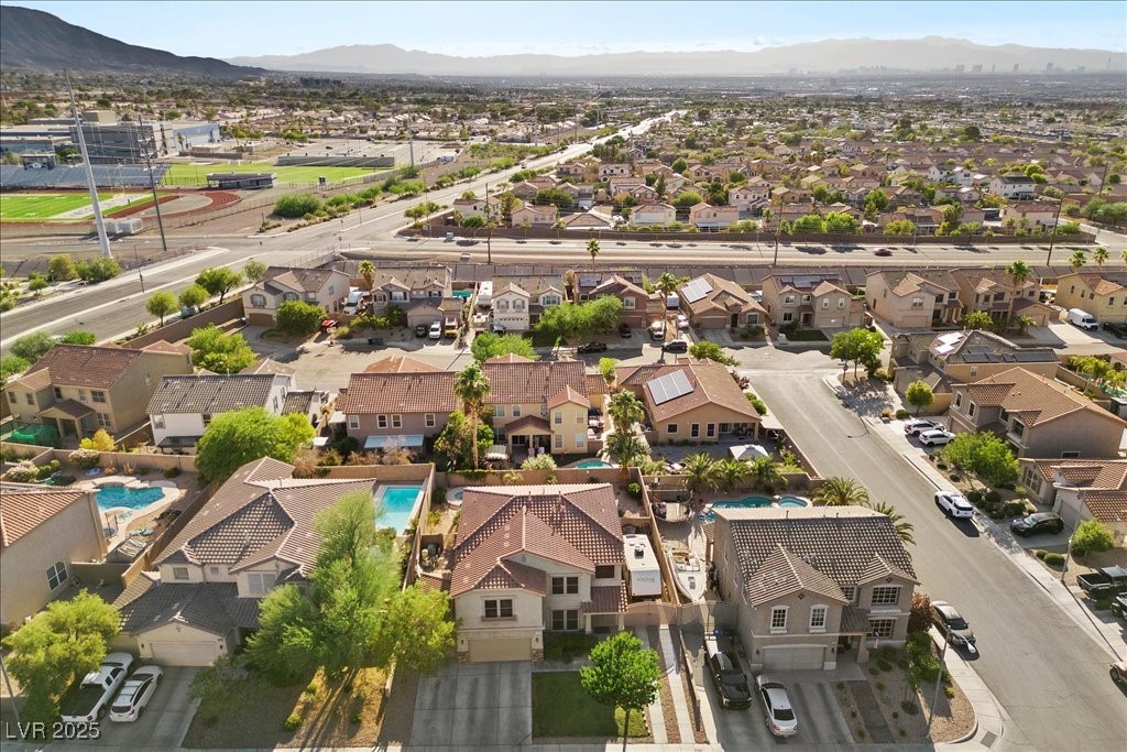249 Cinnamon Ridge Way Henderson, NV 89015 - Photo 69 of 76 Aerial perspective of suburban area featuring a mountain backdrop