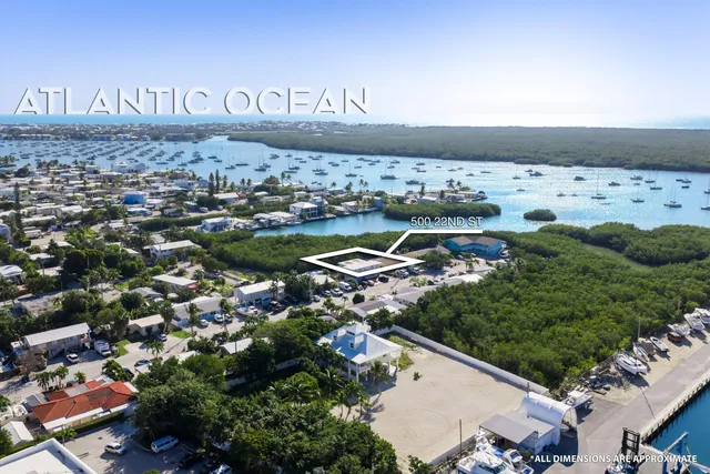 an aerial view of multiple house with yard