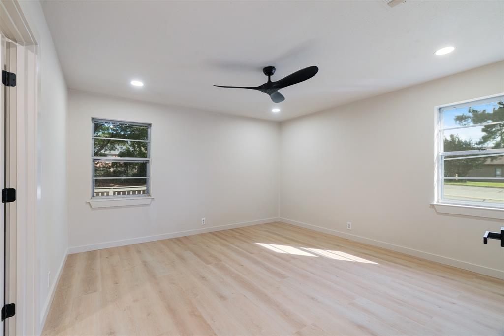1195 33rd Street Southeast Paris, TX 75460 - Photo 11 of 34 wooden floor in an empty room with a window