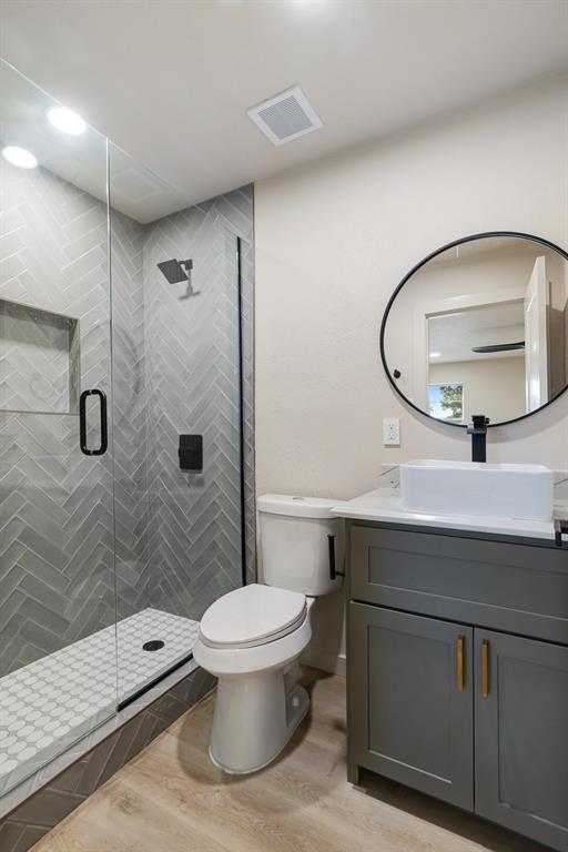 1195 33rd Street Southeast Paris, TX 75460 - Photo 15 of 34 a bathroom with a sink a toilet and shower