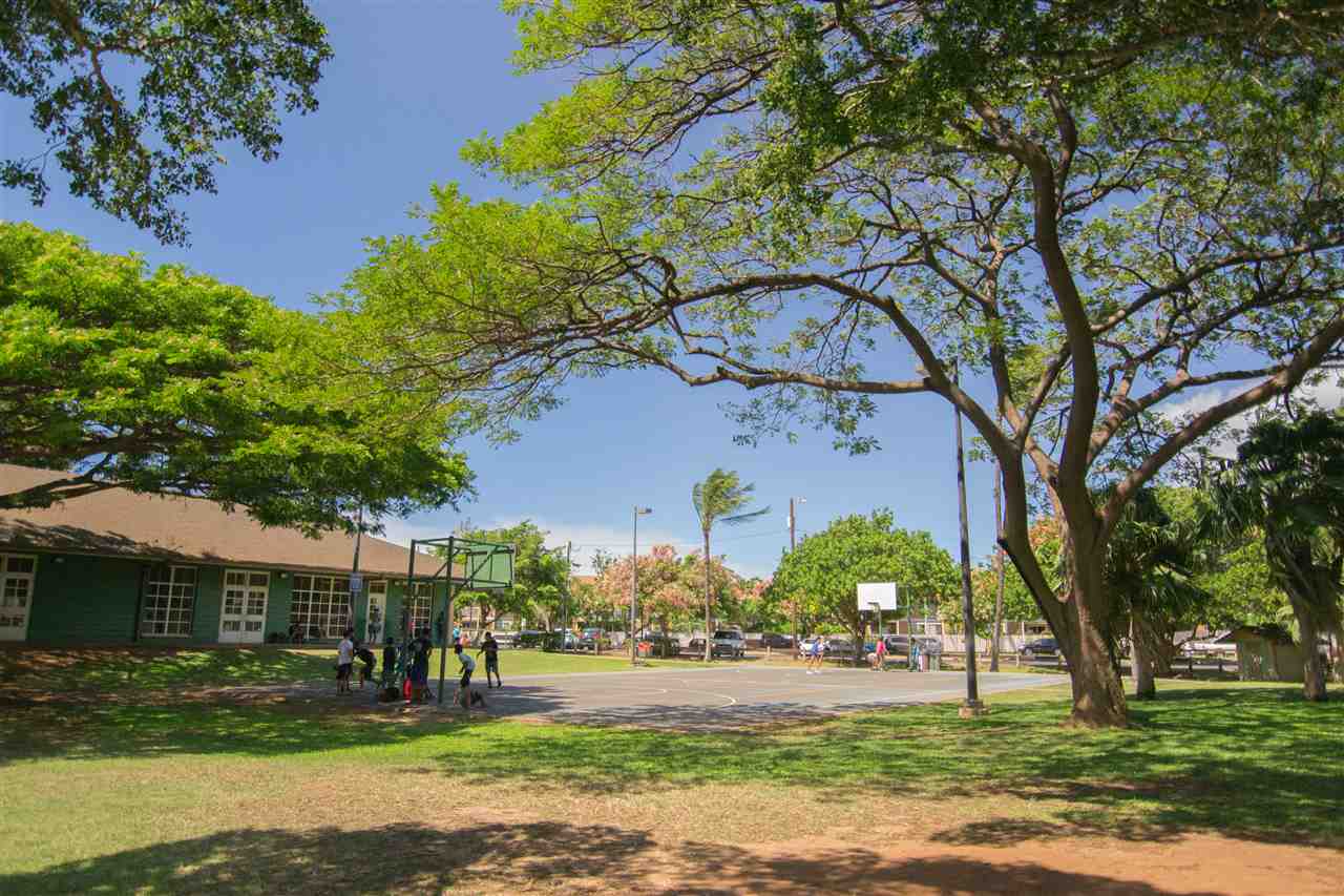 140 Uwapo Road, Unit 49104 Kihei, HI 96753 - Photo 13 of 13 a front view of a house with a yard