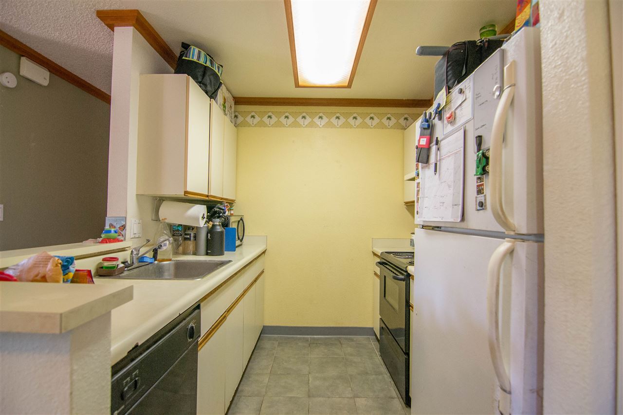 140 Uwapo Road, Unit 49104 Kihei, HI 96753 - Photo 3 of 13 a bathroom with a sink and a mirror