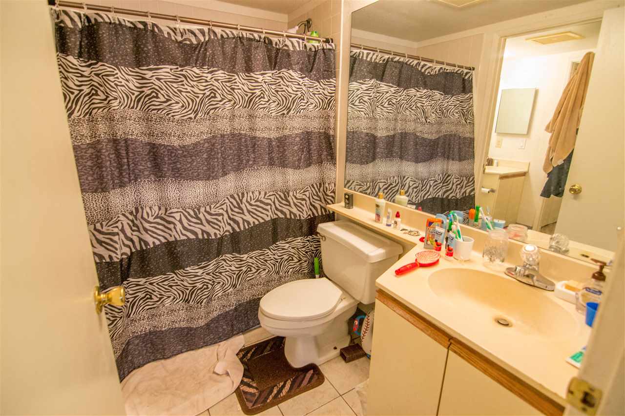 140 Uwapo Road, Unit 49104 Kihei, HI 96753 - Photo 5 of 13 a bathroom with a sink toilet and shower