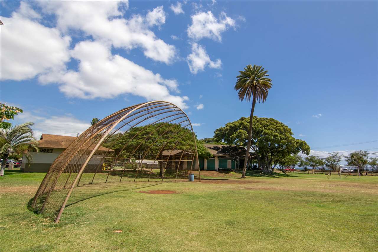 140 Uwapo Road, Unit 49104 Kihei, HI 96753 - Photo 10 of 13 a swimming pool with outdoor seating and yard
