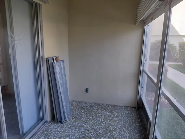 a view of a house with backyard and porch