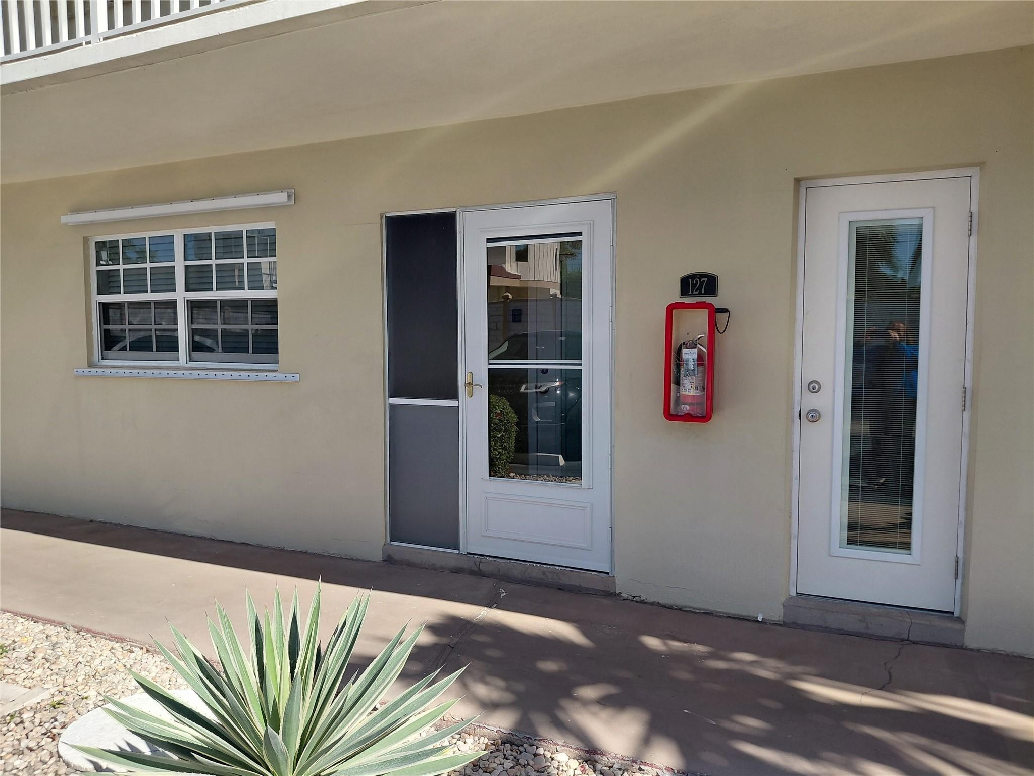 1951 Northeast 39th Street, Unit 127 Lighthouse Point, FL 33064 - Photo 34 of 35 a view of front door