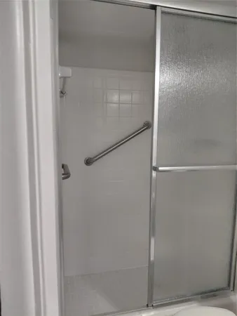 a bedroom with a bed chair and window