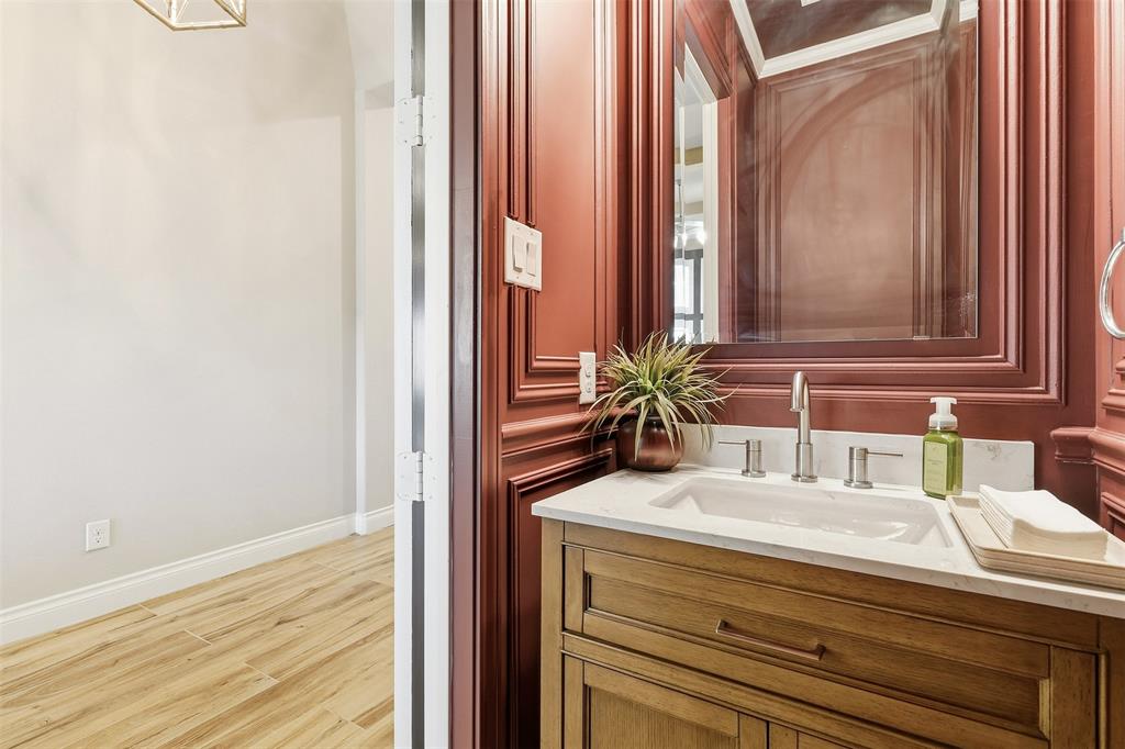 5640 Pradera Road Fort Worth, TX 76126 - Photo 28 of 35 Vanity featuring a white countertop, inset sink, and brushed nickel fixtures