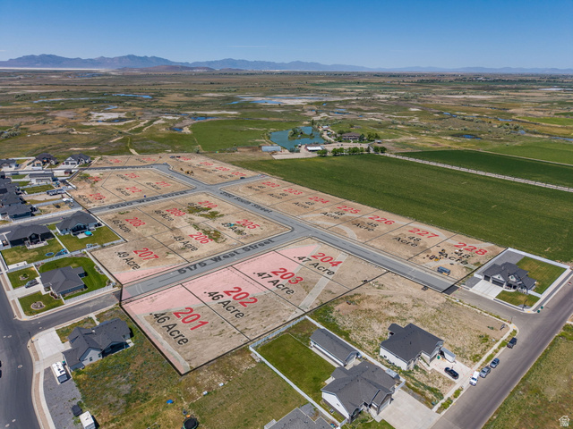 3150 South 5250 West, Unit 210 Hooper, UT 84315 - Photo 1 of 11 Expansive aerial view showcasing a developing residential area with multiple available lots