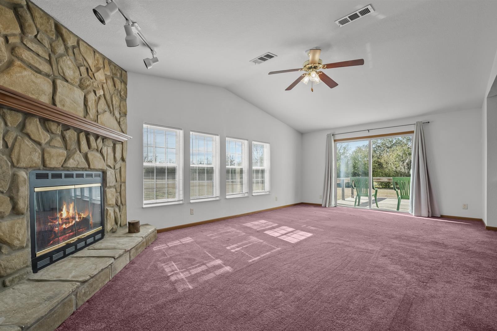 305 Palmetto Bluff Road Palatka, FL 32177 - Photo 12 of 34 a view of empty room with a fireplace and fan