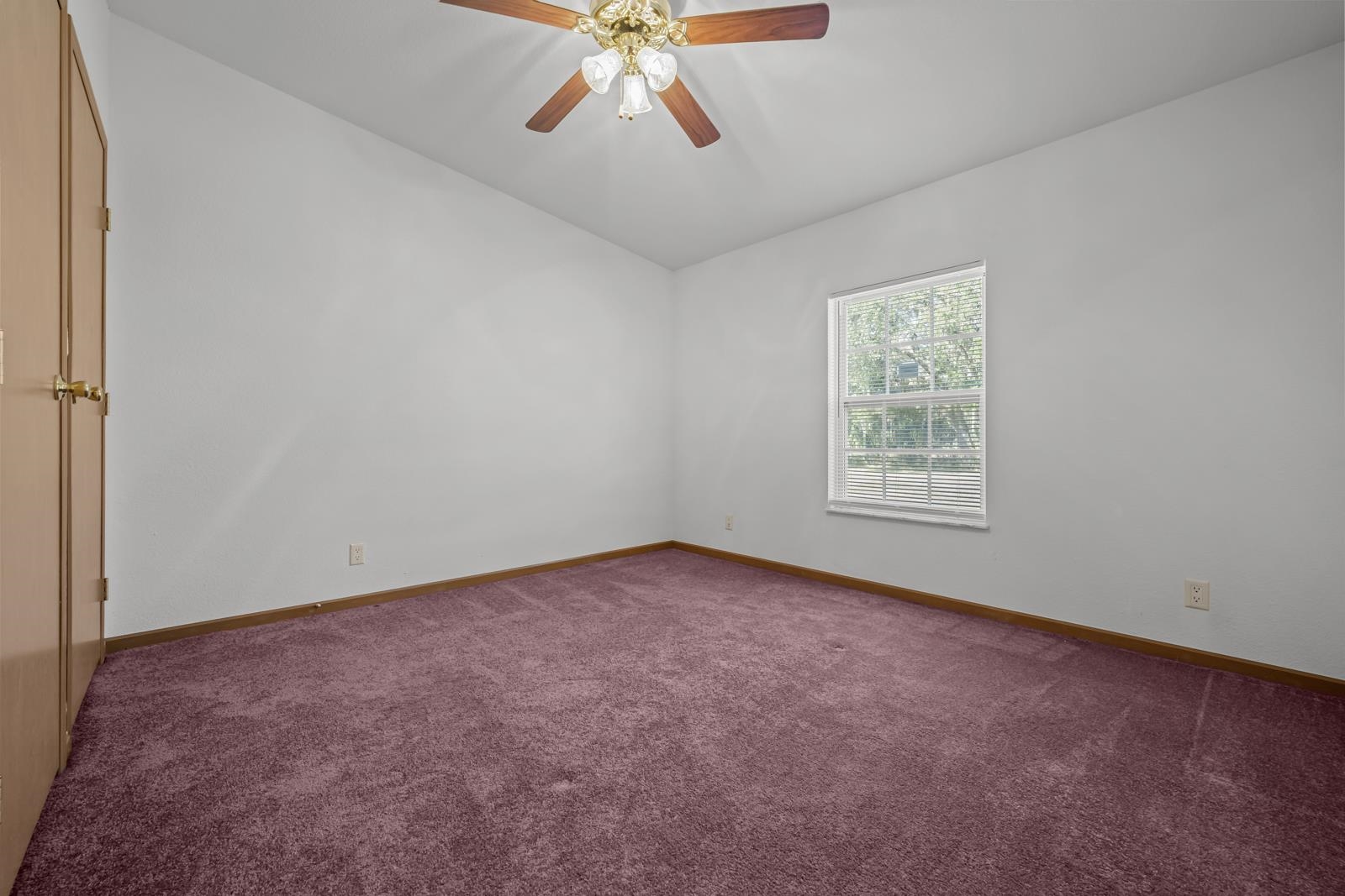 305 Palmetto Bluff Road Palatka, FL 32177 - Photo 20 of 34 Empty room featuring dark carpet, lofted ceiling, and ceiling fan
