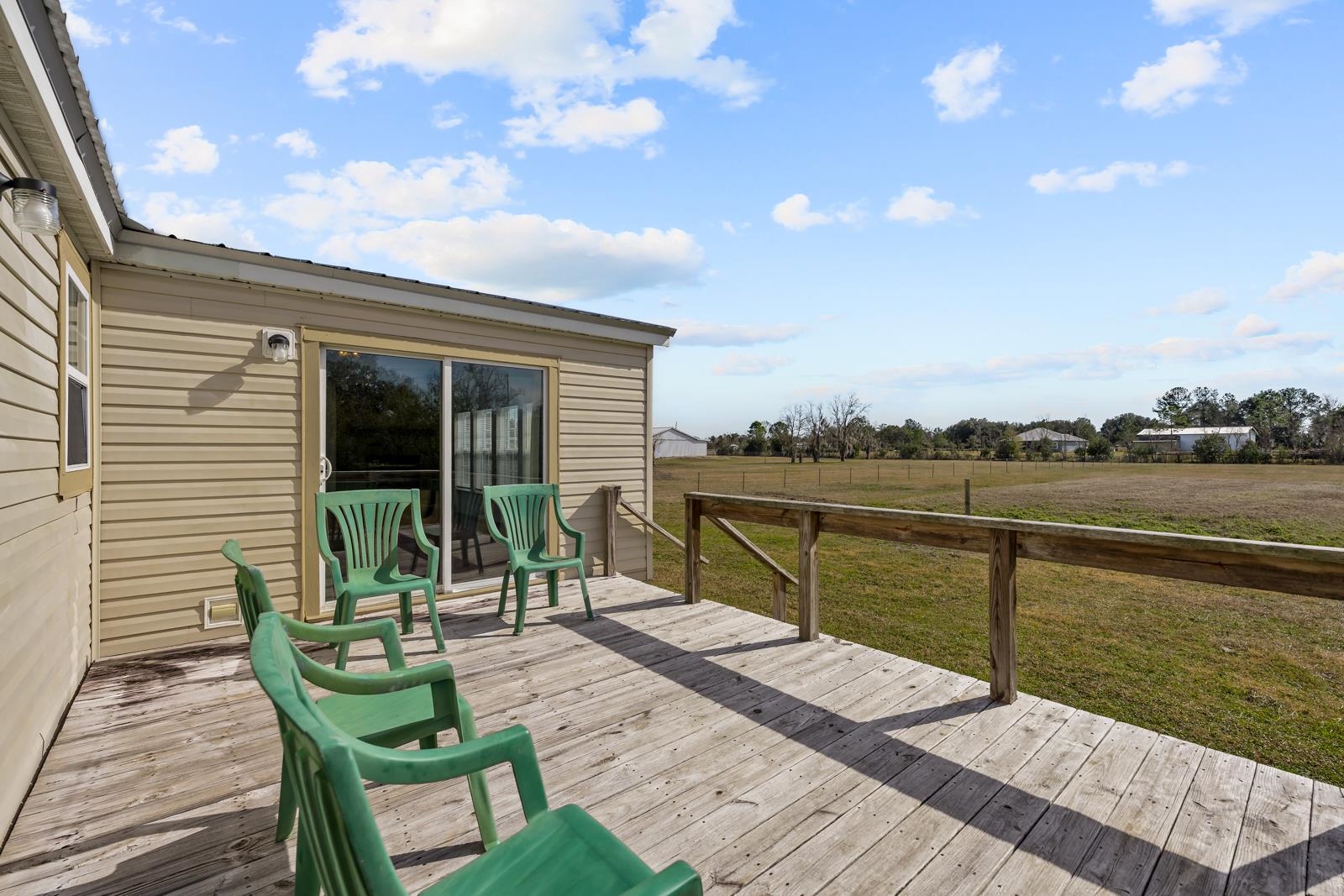 305 Palmetto Bluff Road Palatka, FL 32177 - Photo 25 of 34 Wooden deck featuring a view for entertaining and great sunset viewing!