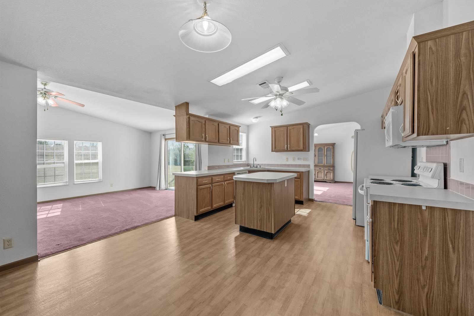 305 Palmetto Bluff Road Palatka, FL 32177 - Photo 10 of 34 a large kitchen with cabinets wooden floor and stainless steel appliances