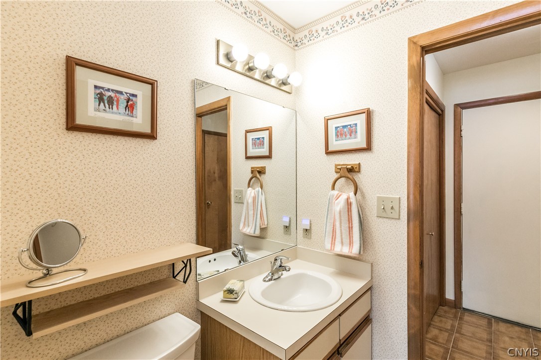 8646 Salt Springs Road Manlius, NY 13104 - Photo 25 of 38 Off the den and the kitchen is a half-bath.