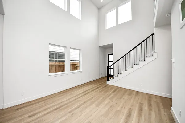 a view of an entryway with wooden floor