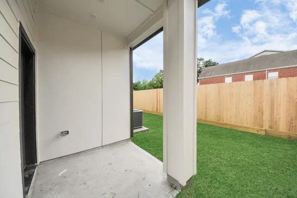 a view of a back yard from a corridor