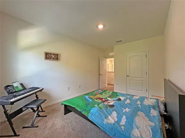 a bedroom with a bed and a table in it