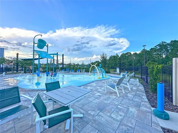 a view of a patio with a table and chairs