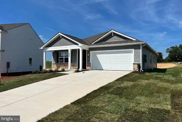 a front view of a house with yard