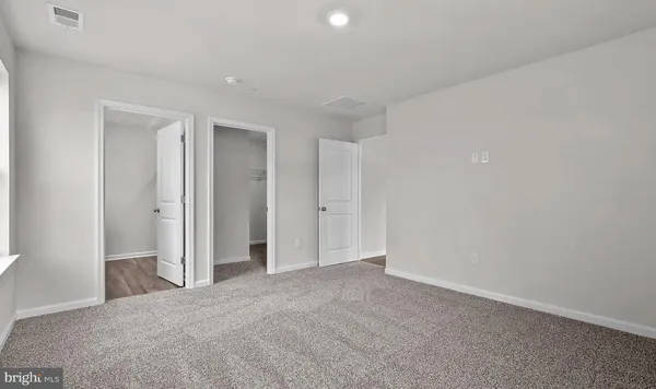 a view of empty room with windows