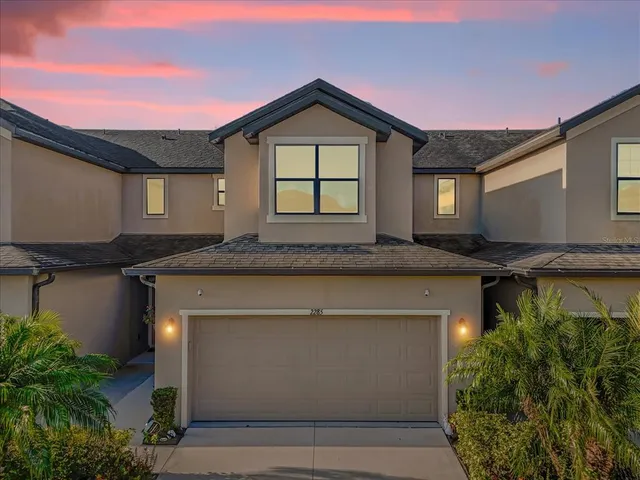a front view of a house with a garage