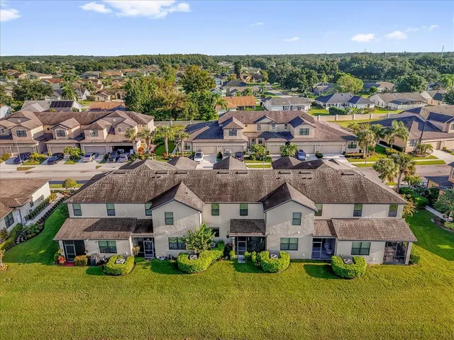 a view of multiple houses with yard
