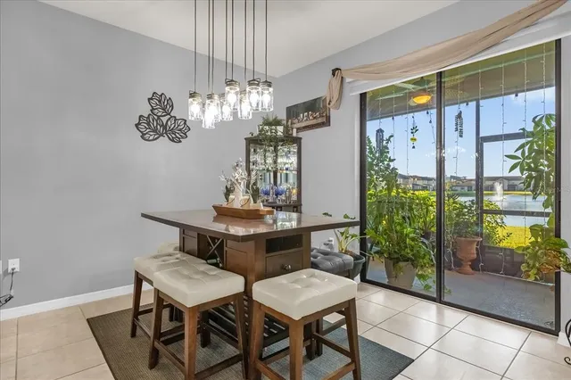 a view of a dining room with furniture and chandelier