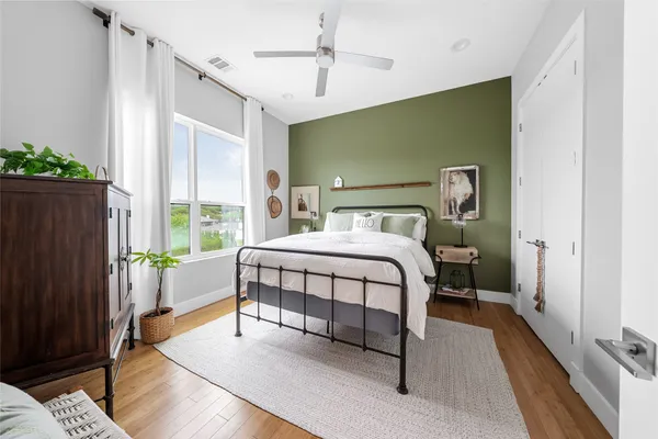 a bedroom with a bed and a window