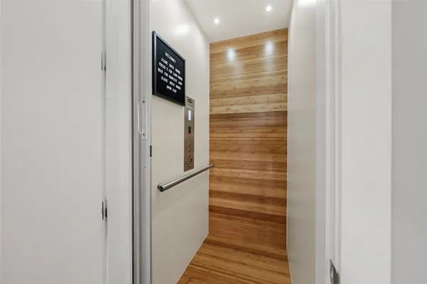 a view of elevator with wooden floor