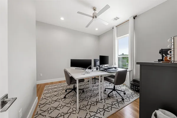 a workspace with furniture and a rug