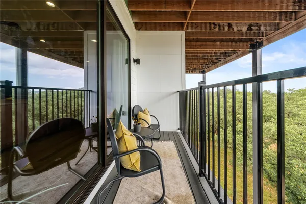 a view of a balcony with car parked