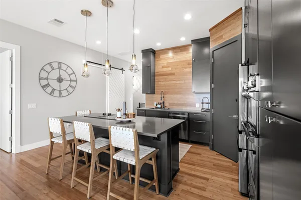 a kitchen with a table and chairs