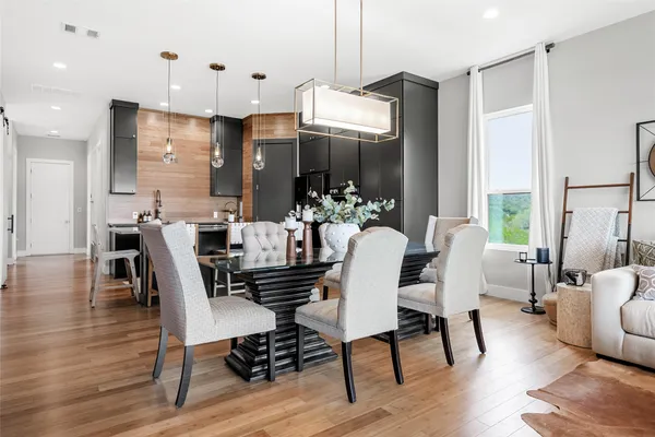 a view of a dining room with furniture window and wooden floor