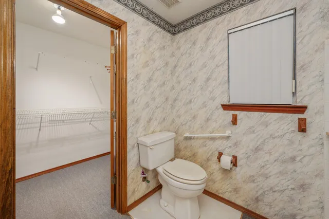 a bathroom with a shower sink and mirror