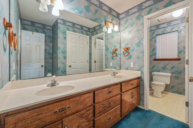 a bathroom with a glass shower door