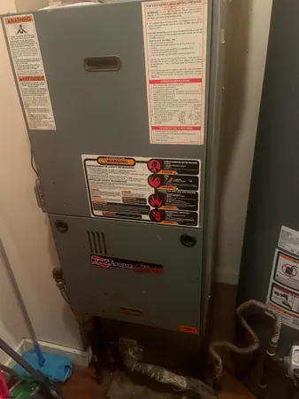 a kitchen with granite countertop a sink a stove and a wooden cabinets