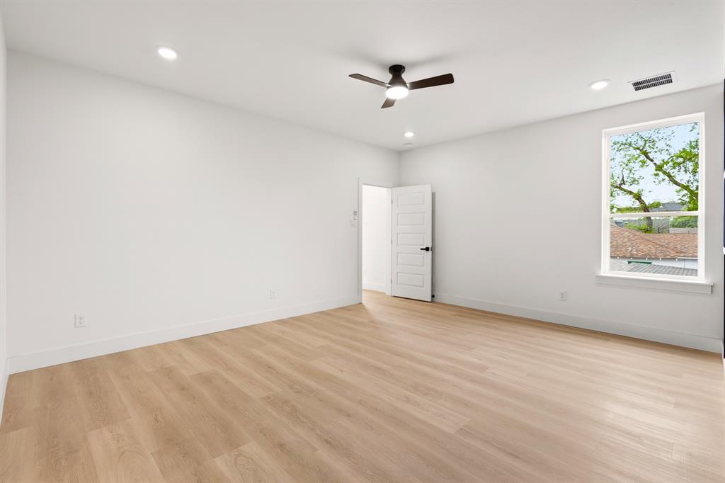 413 North Patton Avenue Dallas, TX 75203 - Photo 18 of 21 wooden floor in an empty room with a window