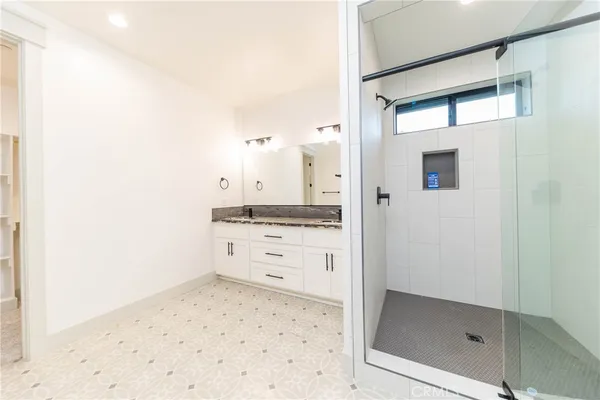 a bathroom with a sink and a shower