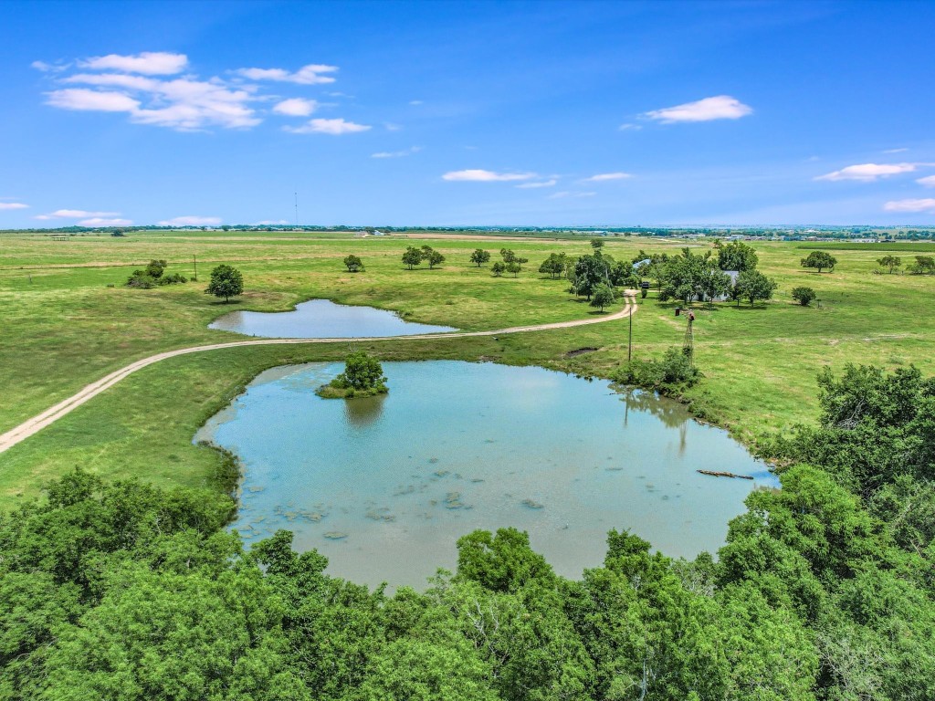 Undisclosed Address Coupland, TX 78615 - Photo 3 of 11 a view of a lake with a big yard