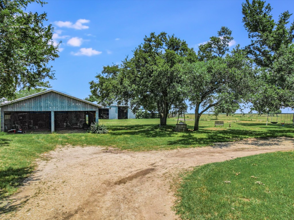Undisclosed Address Coupland, TX 78615 - Photo 5 of 11 a view of a house with a yard