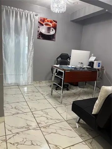 a living room with a couch and a table