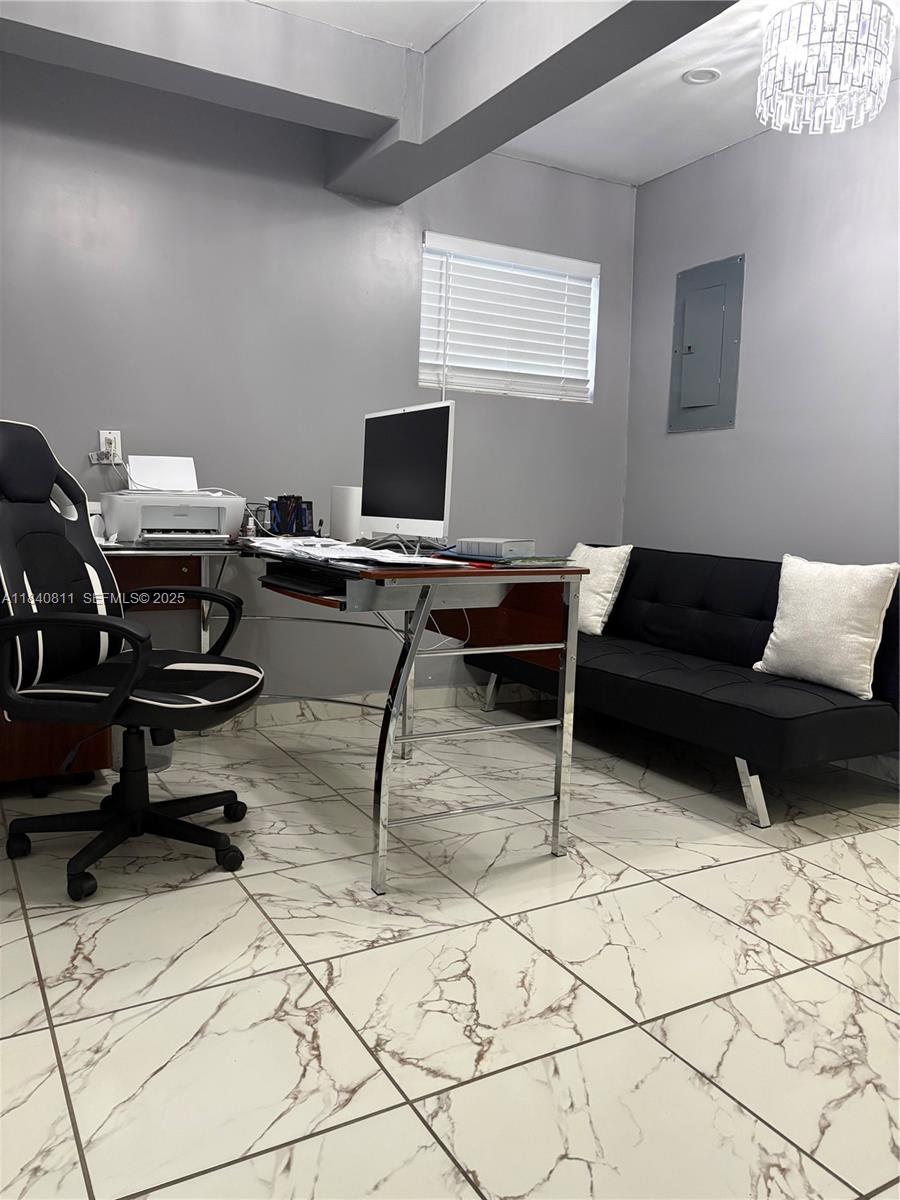 821 East 13th Street Hialeah, FL 33010 - Photo 14 of 25 a view of a workspace with furniture