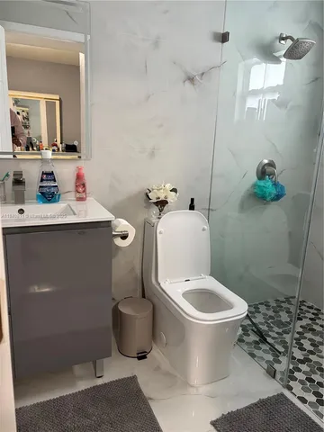 a bathroom with a toilet and a sink