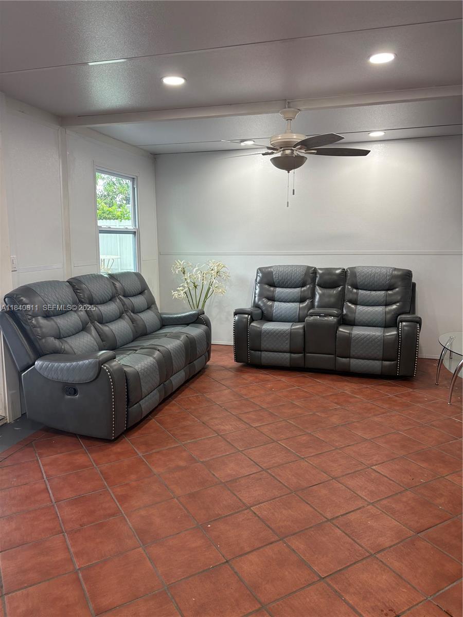 821 East 13th Street Hialeah, FL 33010 - Photo 21 of 25 a living room with furniture and a window