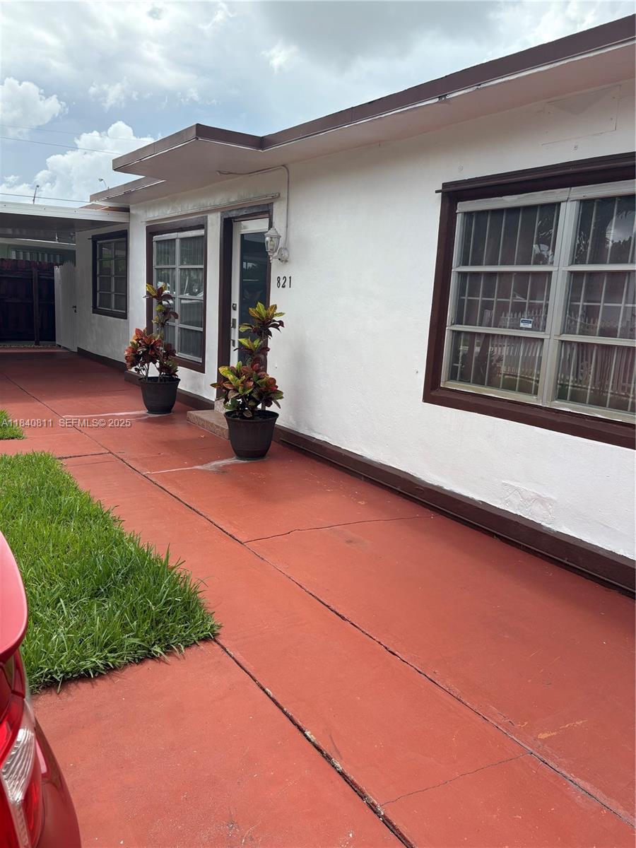 821 East 13th Street Hialeah, FL 33010 - Photo 6 of 25 a view of a house with backyard and porch