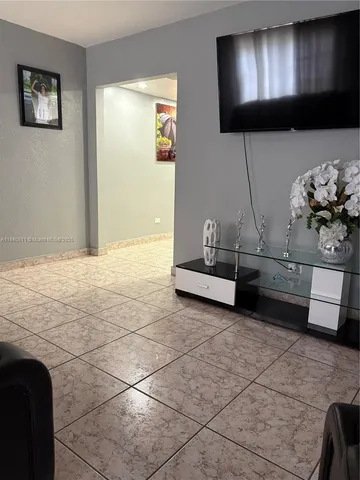 a view of kitchen with furniture and natural light